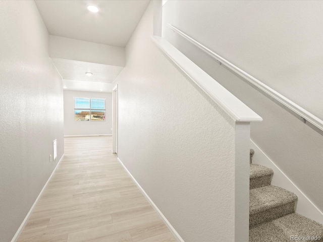 stairs with wood-type flooring