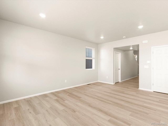 spare room featuring light hardwood / wood-style floors