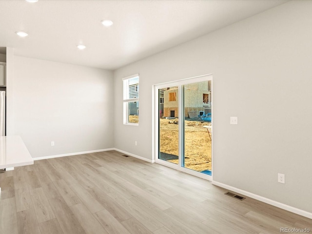 unfurnished room featuring light hardwood / wood-style flooring