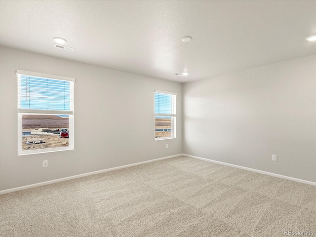 empty room featuring carpet flooring