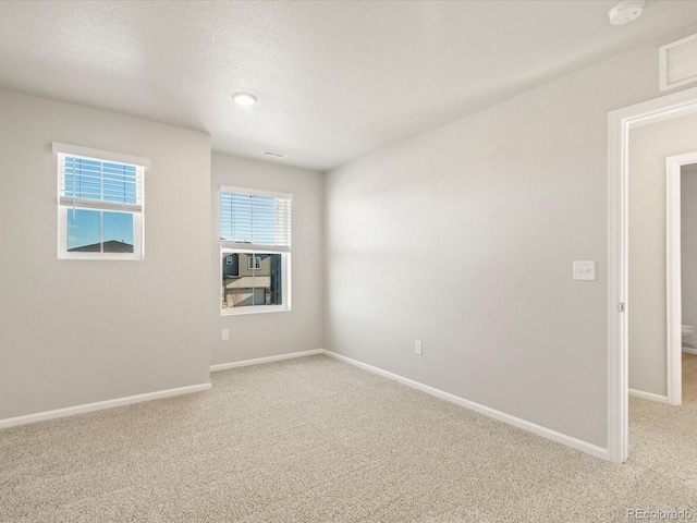 empty room featuring carpet floors