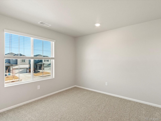 spare room featuring carpet flooring