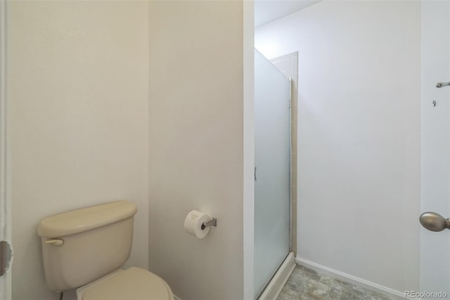 bathroom with walk in shower and toilet