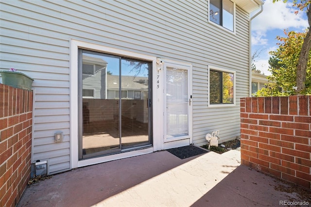 entrance to property with a patio area