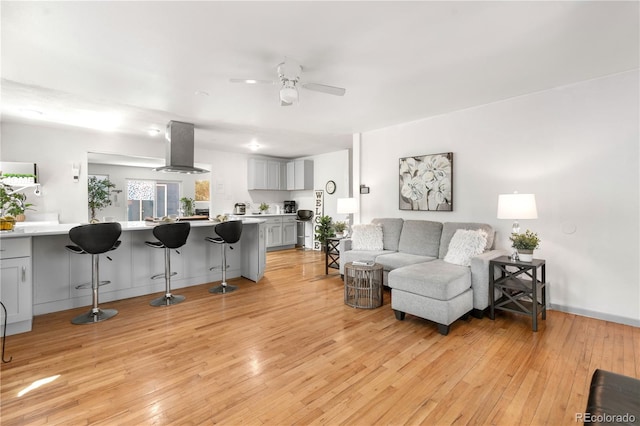 935 S Pecos Way, Denver, CO 80223 - living area featuring a ceiling fan and light wood-style flooring