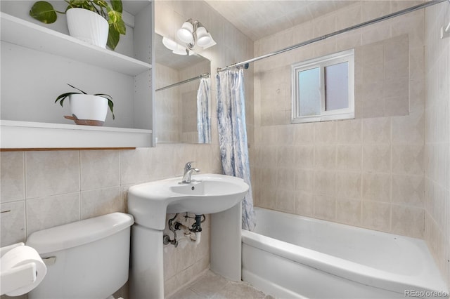 935 S Pecos Way, Denver, CO 80223 - bathroom with shower / tub combo and tile walls