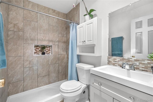 935 S Pecos Way, Denver, CO 80223 - bathroom featuring vanity, tasteful backsplash, and a tile shower