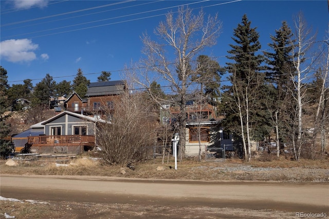 obstructed view of property featuring a wooden deck