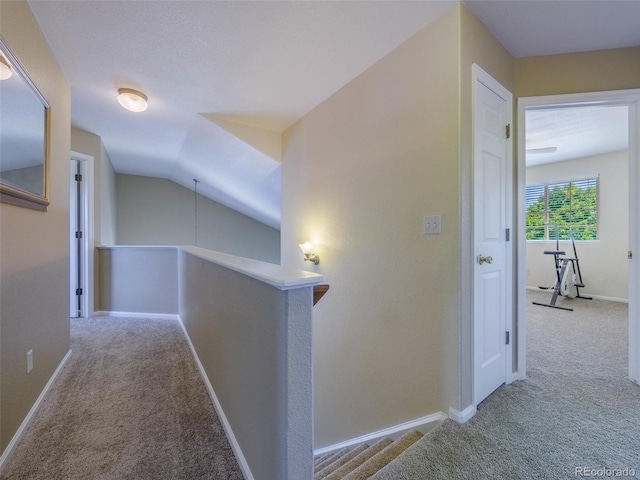 5369 Creek Way, Parker, CO 80134 - hallway with an upstairs landing, carpet flooring, baseboards, and vaulted ceiling