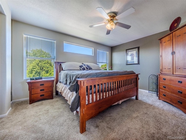 5369 Creek Way, Parker, CO 80134 - bedroom with light colored carpet, baseboards, a ceiling fan, and a textured ceiling