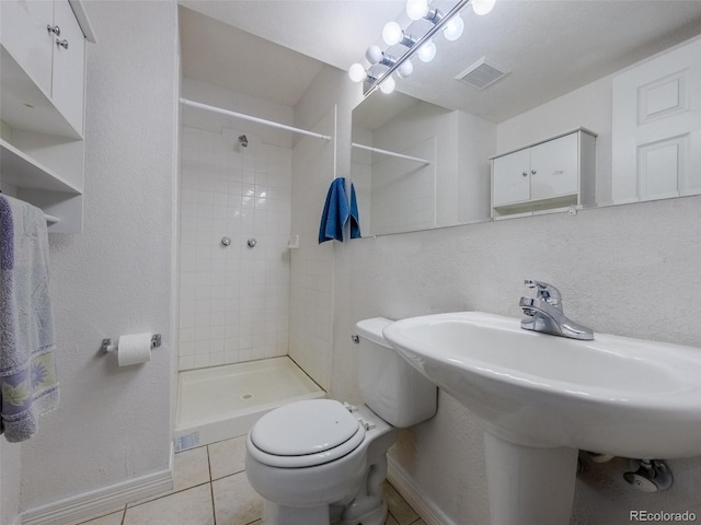 5369 Creek Way, Parker, CO 80134 - full bath featuring baseboards, a stall shower, toilet, and tile patterned floors