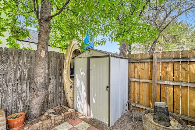 view of shed featuring a fenced backyard