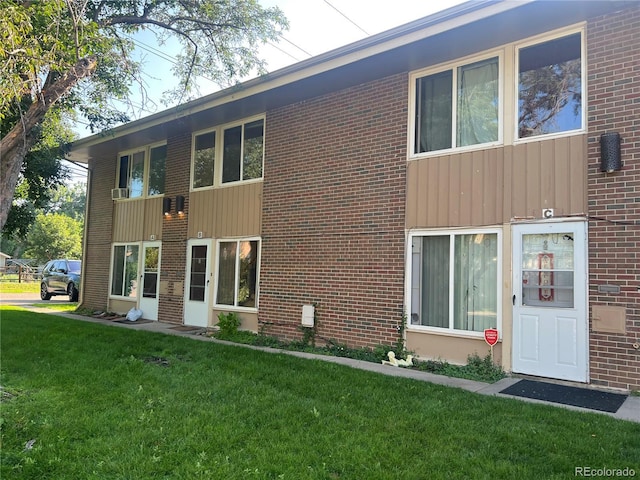 8682 W 51st Ave, Arvada, CO 80002 - view of front facade with a front lawn and brick siding