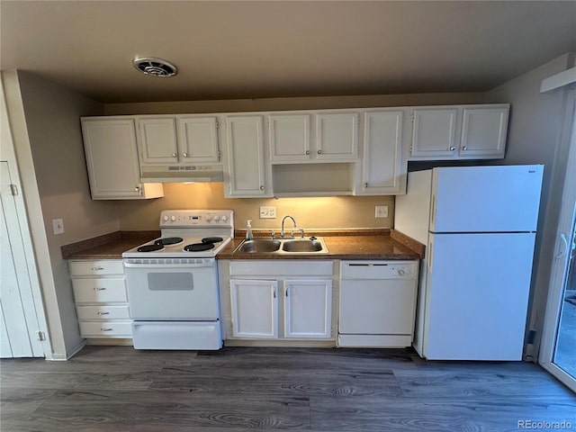 8682 W 51st Ave, Arvada, CO 80002 - kitchen with white appliances, under cabinet range hood, white cabinetry, and dark wood-style floors