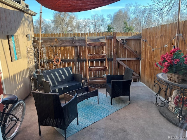 8682 W 51st Ave, Arvada, CO 80002 - view of patio / terrace featuring an outdoor hangout area and a gate