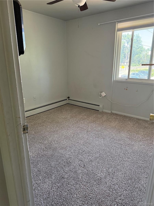 8682 W 51st Ave, Arvada, CO 80002 - empty room featuring a ceiling fan and a baseboard heating unit