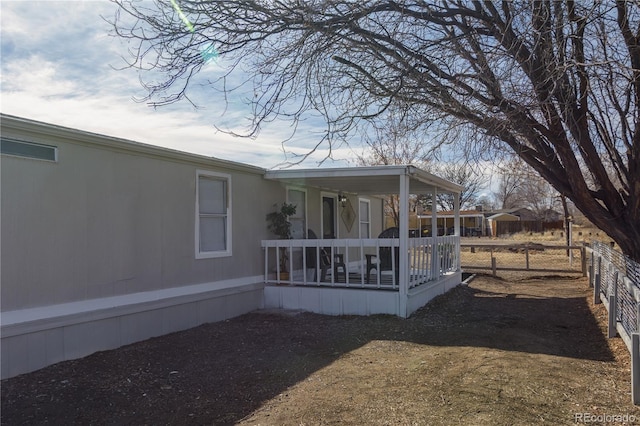 890 S Cellini Plz, Pueblo West, CO 81007 - rear view of house featuring a porch