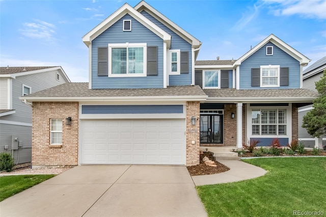 20339 Vista Cir, Parker, CO 80138 - view of front of home with brick siding, driveway, a front yard, an attached garage, and roof with shingles