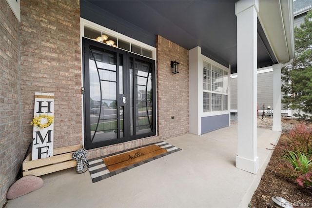 20339 Vista Cir, Parker, CO 80138 - view of exterior entry featuring brick siding and covered porch