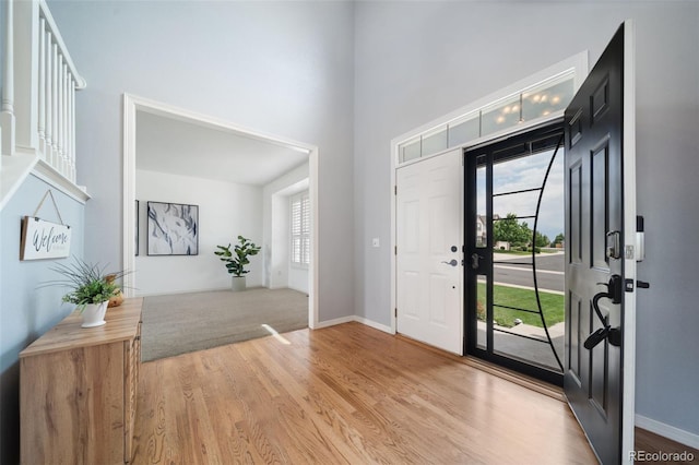 20339 Vista Cir, Parker, CO 80138 - foyer with plenty of natural light, light wood-style floors, and a towering ceiling