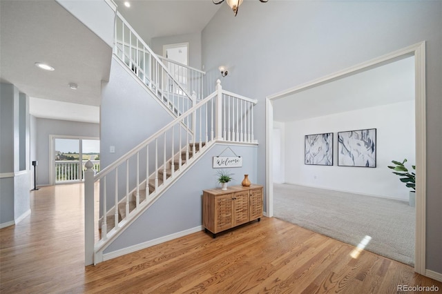 20339 Vista Cir, Parker, CO 80138 - staircase with a towering ceiling and wood finished floors