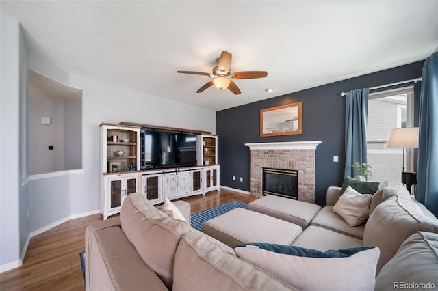 20339 Vista Cir, Parker, CO 80138 - living area featuring a ceiling fan, wood finished floors, and a fireplace