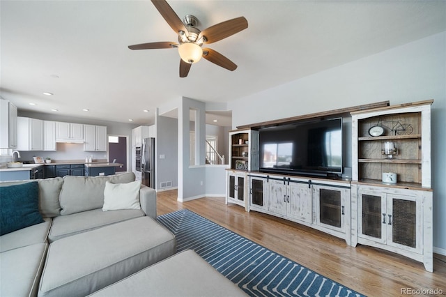 20339 Vista Cir, Parker, CO 80138 - living area featuring light wood-style flooring and a ceiling fan