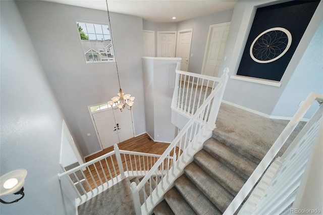 20339 Vista Cir, Parker, CO 80138 - stairs featuring a chandelier and baseboards