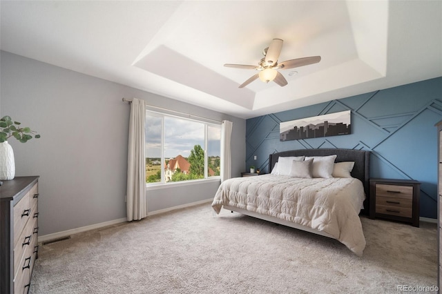 20339 Vista Cir, Parker, CO 80138 - bedroom featuring a tray ceiling, carpet floors, and a ceiling fan