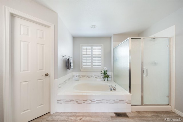 20339 Vista Cir, Parker, CO 80138 - bathroom featuring a garden tub, a stall shower, and wood finished floors