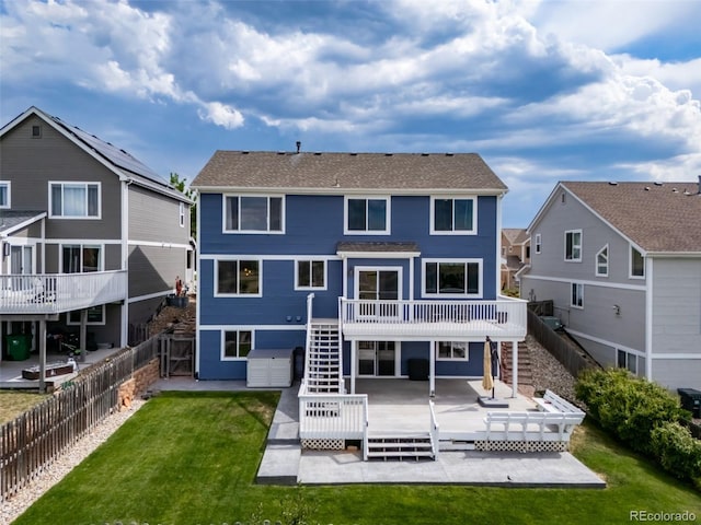 20339 Vista Cir, Parker, CO 80138 - back of property with stairway, a deck, a patio, and a fenced backyard