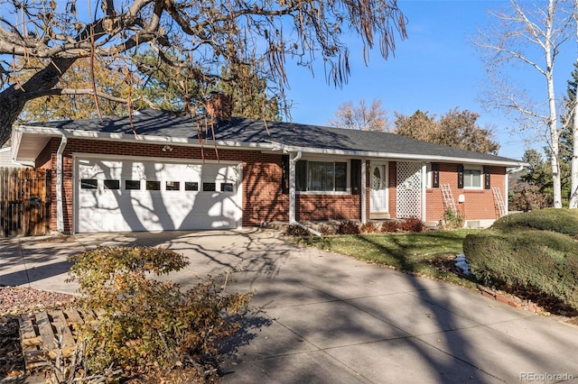 ranch-style home featuring a garage and a front lawn