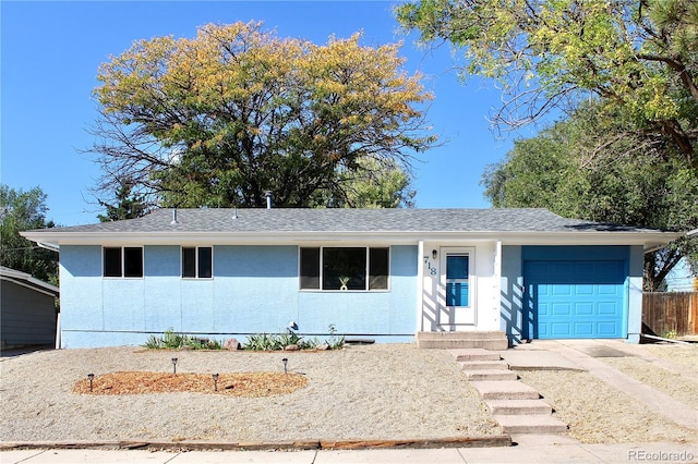 single story home with a garage