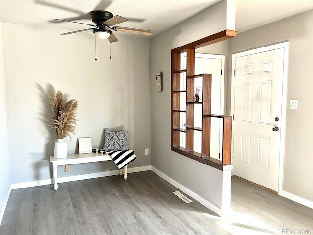 foyer entrance featuring ceiling fan and hardwood / wood-style floors