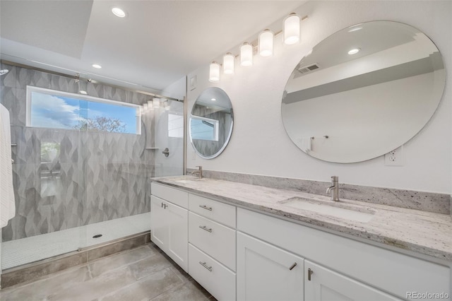 4390 Osage St, Denver, CO 80211 - full bathroom with double vanity, a sink, visible vents, walk in shower, and recessed lighting