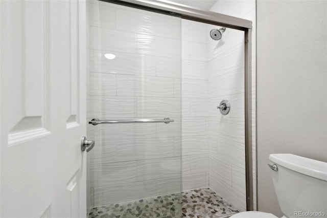 5875 E Iliff Ave Unit 108, Denver, CO 80222 - full bathroom featuring a shower stall and toilet