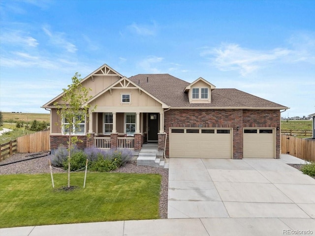 13476 Willow St, Thornton, CO 80602 - craftsman-style home with a porch, an attached garage, concrete driveway, board and batten siding, and brick siding