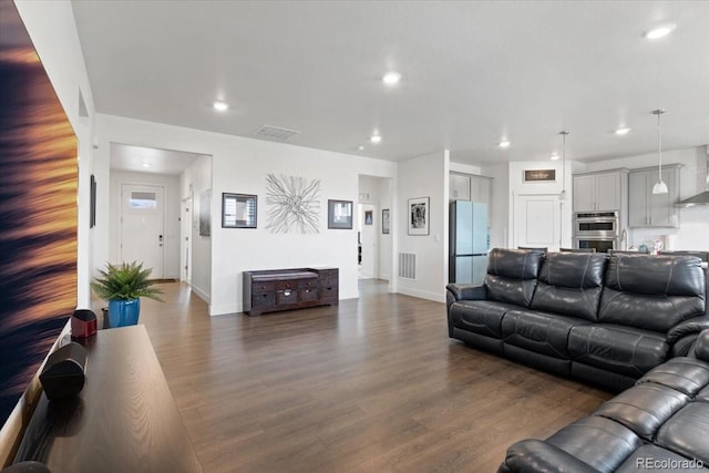 13476 Willow St, Thornton, CO 80602 - living area featuring dark wood-style flooring and recessed lighting