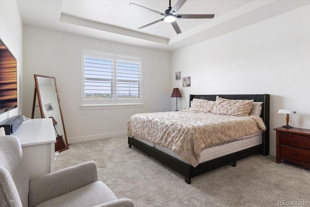 13476 Willow St, Thornton, CO 80602 - bedroom with a tray ceiling, light colored carpet, and ceiling fan