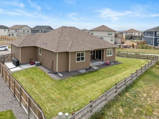 13476 Willow St, Thornton, CO 80602 - back of house featuring a patio area, a shingled roof, a residential view, and a fenced backyard