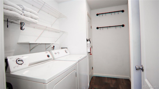1503 Osage Ave, Fort Morgan, CO 80701 - washroom with washer and clothes dryer, dark wood-type flooring, and baseboards