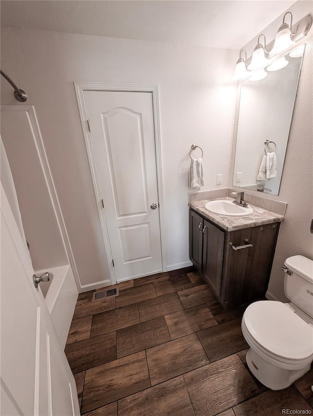 1503 Osage Ave, Fort Morgan, CO 80701 - full bath with vanity, shower / bathtub combination, and wood tiled floors