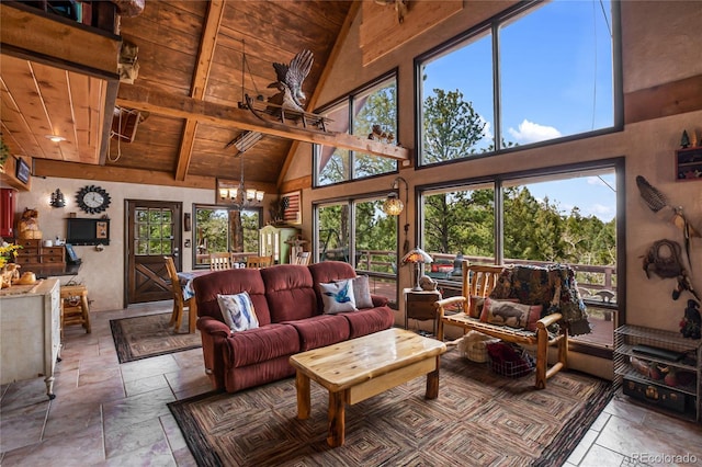 2169 Spruce Rd, Woodland Park, CO 80863 - living area with high vaulted ceiling, a wood ceiling with exposed beams, and stone tile floors