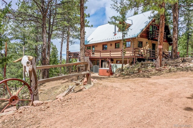 2169 Spruce Rd, Woodland Park, CO 80863 - view of front of house with a metal roof and a deck