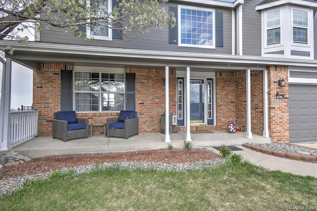 exterior space with brick siding and a porch