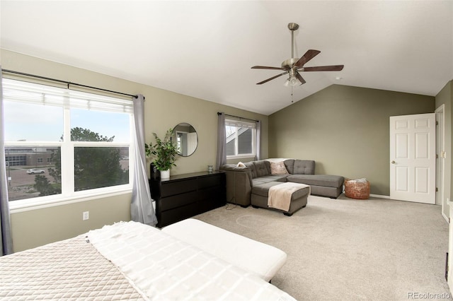 carpeted bedroom with lofted ceiling, a ceiling fan, and baseboards