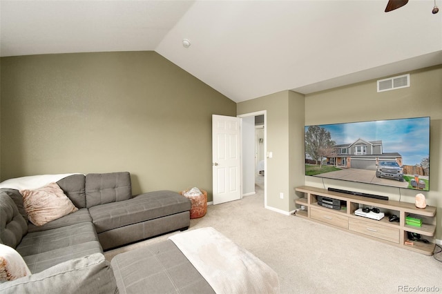 living room with ceiling fan, vaulted ceiling, visible vents, and carpet