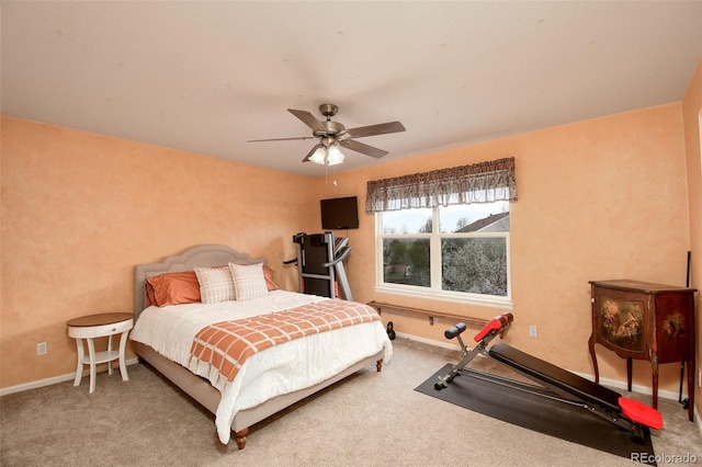 carpeted bedroom with baseboards and ceiling fan