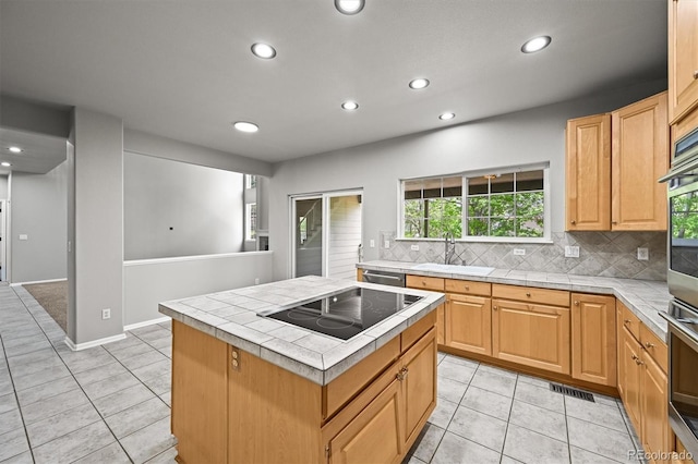 2732 Flint Ct, Superior, CO 80027 - kitchen with a sink, appliances with stainless steel finishes, tile counters, recessed lighting, and light tile patterned floors