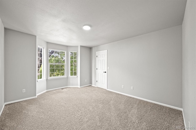 2732 Flint Ct, Superior, CO 80027 - unfurnished room with carpet, baseboards, and a textured ceiling